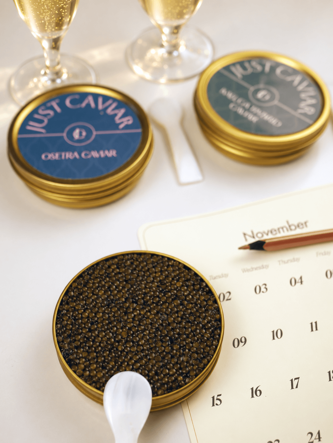 Caviar on ice with two glasses of sparkling wine