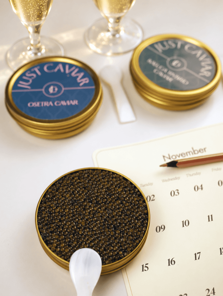 Caviar on ice with two glasses of sparkling wine